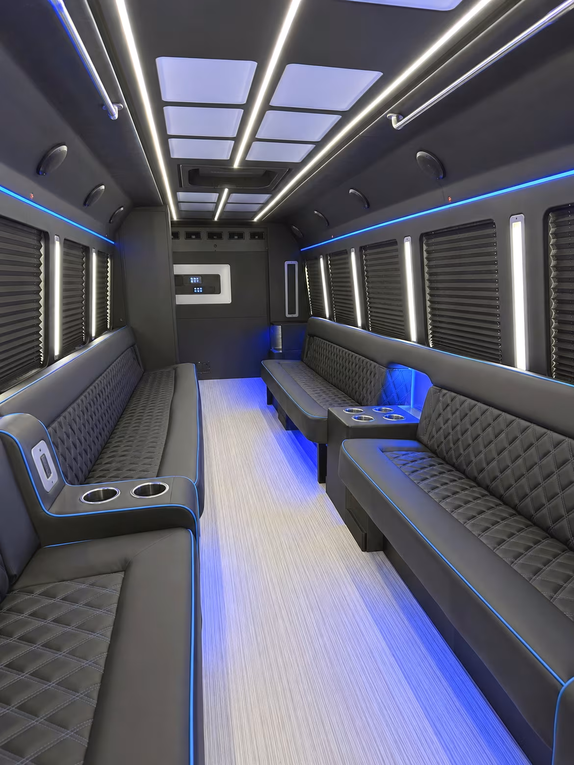 Friends laughing during a party bus celebration in Sterling Heights