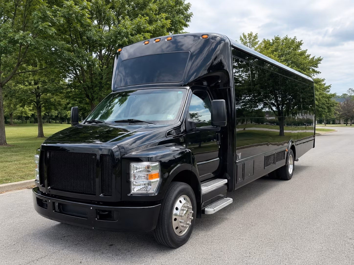 Group beside a Mercedes Sprinter limo in Sterling Heights
